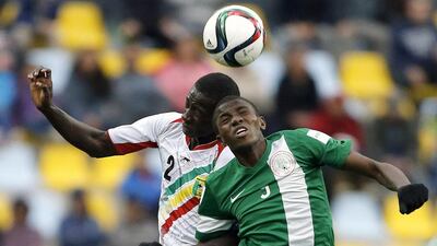Mali’s Abdoul Dante and Nigeria’s Victor Osimhen vie for a header on Sunday during the 2015 U17 World Cup final. Marcelo Hernandez / AFP