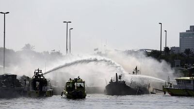 Dubai Civil Defence tackles a fire at Dubai Creek on Monday. Kamran Jebreili / AP Photo