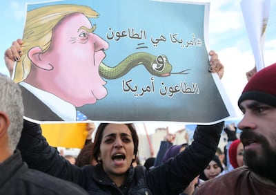 Jordanians protest for the decision that American president took over Jerusalem, Tuesday, December 7, 2017 in front of the American embassy in Amman, Jordan. Salah Malkawi