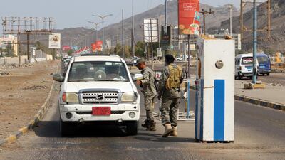 Security Belt Force fighters man a checkpoint in the Khor Maksar district of Yemen's second city of Aden. AFP