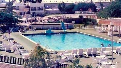 The swimming pool of Al Mina's The Club is shown in the 1980s. Sheikh Zayed gifted the land the venue sits on.