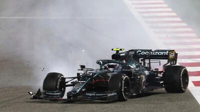 Aston Martin driver Sebastian Vettel crashes with Alpine driver Esteban Ocon during the Bahrain GP. PA