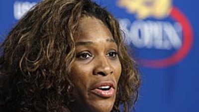 Serena Williams addresses the press following her doubles victory with sister Venus.