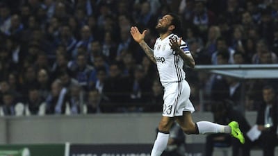 Juventus' Dani Alves celebrates after scoring his side's second goal against Porto. Paulo Duarte / AP