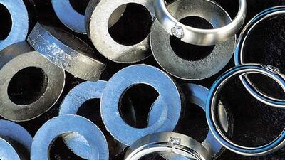 Above, platinum washers being produced by Anglo American. Platinum prices dropped 3.6 per cent on Tuesday, their biggest one-day fall in more than two years. Anglo American Platinum via Bloomberg News