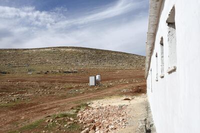A hut close to the school serves as the teacher's toilet. A bathroom for the pupils remains unfinished and the school lacks running water. Rose Scammell for The National