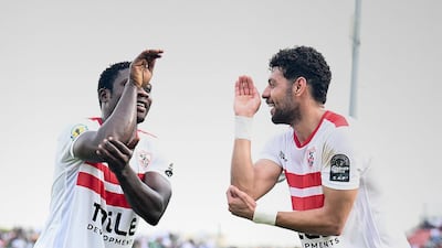 Zamalek's Samson Akinyoola, left, celebrates with teammate Mostafa Shalaby after scoring against Dreams FC.