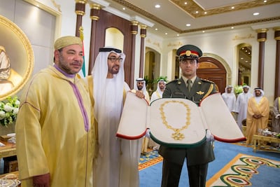 Sheikh Mohamed bin Zayed presents the Zayed Medal to King Mohammed VI of Morocco during a reception held at Mushrif Palace. Crown Prince Court.