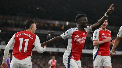 Arsenal's Bukayo Saka celebrates scoring the team's second goal in a 2-1 win over Fulham. AFP