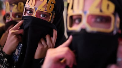 People wear '2026' glasses during New Year's celebrations in Lusail, Qatar. Reuters