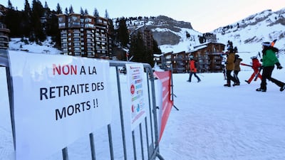 A placard which reads 'No to retirement in death' is displayed as workers at the French ski resort Avoriaz protest. Reuters