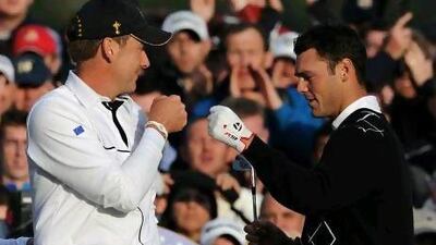 Martin Kaymer, right, a European Ryder Cup rookie in 2010, said he benefited from the wisdom of wise heads such as Ian Poulter, left. Adrian Dennis / AFP