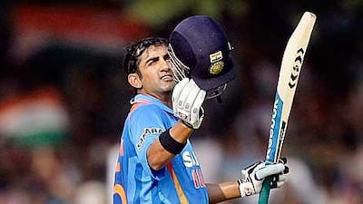 India's Gautam Gambhir celebrates after scoring a century during the third ODI against New Zealand in Vadodara.