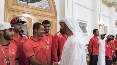Sheikh Mohammed bin Zayed, Crown Prince of Abu Dhabi and Deputy Supreme Commander of the UAE Armed Forces (R), greets a member of the UAE Special Olympics team, during a Sea Palace barza. Mohamed Al Hammadi / Crown Prince Court - Abu Dhabi