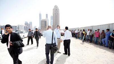 Buildings in Dubai Media City being evacuated following tremors from an earthquake in Iran earlier this month. Sarah Dea / The National