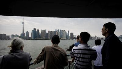 Tourists on the Centre Island ferry in Toronto, Canada. The city’s tourism authority says it has invested greatly to make visitors from the Middle East more comfortable in travelling there. Brent Lewin /Bloomberg News