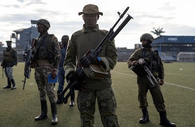 M23 rebels stand guard at the the Unite stadium in Goma, North Kivu, the Democratic Republic of the Congo, on May 10. Reuters