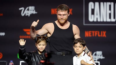 Canelo poses with his daughter Maria Fernanda and his son Saul Adiel. AFP