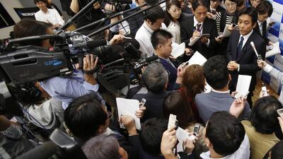 Recruit Holdings president and chief executive Masumi Minegishi speaks to the media after a news conference in Tokyo on October 16, 2014. Staffing firm Recruit Holdings surged in its market debut in Tokyo on Thursday, with investors leaping at a rare opportunity to grab part of a big Japanese company with strong online growth prospects. Yuya Shino / Reuters
