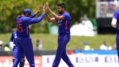 India's Rohit Sharma, left, celebrates with Avesh Khan after the dismissal of Brandon King. AP