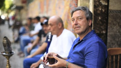 Chef John Torode drinking coffee in Cairo during the filming of his Middle East series. Photo: David Warren