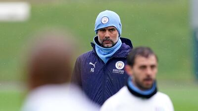 Pep Guardiola oversees a Mancchester City training session at the City Football Academy. PA