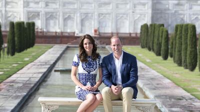Prince William and Catherine, Duchess of Cambridge sit in front of the Taj Mahal during a tour of India and Bhutan in April 2016. Getty Images