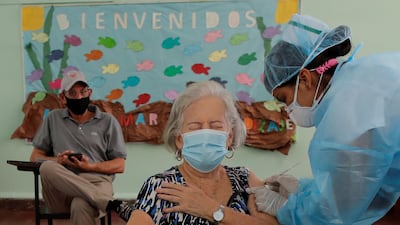 A woman receives the second dose of the Pfizer vaccine at the Belisario Porras School, in Panama City, Panama. The president of Panama, Laurentino Cortizo, announced that another batch of Pfizer vaccines will arrive, assuring that the country has enough doses. EPA