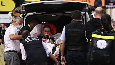 Australian rider Caleb Ewan of the Lotto Soudal team is taken to an ambulance after he crashed shortly before the finish line of the third stage of the Tour de France. EPA