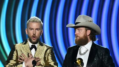 The Brothers Osborne accept the trophy for Best Country Duo Performance during the the 64th Annual Grammy Awards pre-telecast show in Las Vegas. AFP