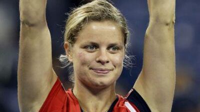 Kim Clijsters holds aloft the trophy after winning the women's singles title at the US Open.