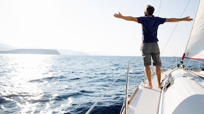 Investing in income-generating assets and being frugal allows you to find the right balance between building long-term wealth and enjoying a fulfilling and happy life. Getty