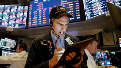 Traders on the floor at the New York Stock Exchange. Low interest rates have helped to fuel an equities boom that has seen the S&P 500 index climb 20% in 2019. A study by Bain & Co finds retunrs of private equity firms are no longer starkly outperforming those of equties. Reuters