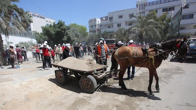 A horse and cart are used in the Gaza clean-up after the 11-day bombardment.