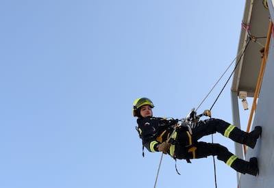 The team had to take part in abseiling exercises as part of the training. Chris Whiteoak / The National