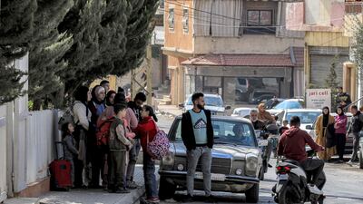 People prepare to leave Baalbek on Wednesday after the Israeli army warned of incoming strikes. Mayor Mustafa Al Chal told 'The National' this week that 'nowhere is safe, not even the ruins'. AFP