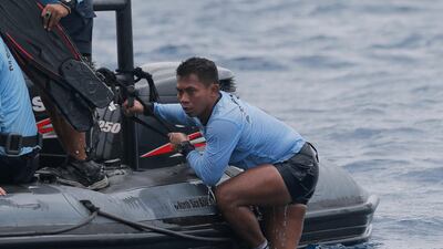 An Indonesian Navy diver emerges from the water during a search operation for victims of the crashed Lion Air plane. AP