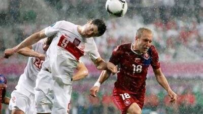 Poland’s Robert Lewandowski, left, beats the Czech Republic’s Daniel Kolar to head the ball. Petr Josek / Reuters