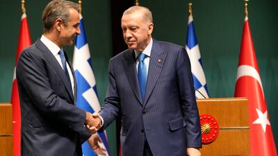 Greek Prime Minister Kyriakos Mitsotakis and Turkish President Recep Tayyip Erdogan shake hands after a joint news conference in Ankara, Turkey. AP