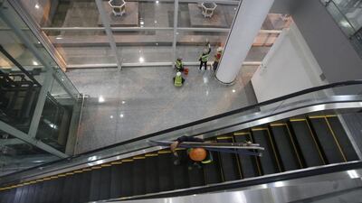 Workers put the final touches to the new terminal at Noi Bai international airport. Flag carrier Vietnam Airlines became the first airline to use the terminal for its Flight VN661 from Hanoi to Singapore on Christmas day. Kham / Reuters