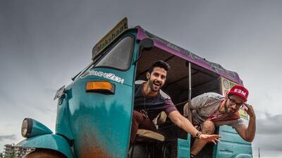 Emirati Peyman Al Awadhi, right, and Abdullah Al Jumah, from Saudi Arabia, will visit seven cities in their three-wheeler in their 1,200-kilometre Rickshaw Challenge across India. Courtesy Peyman Al Awadhi