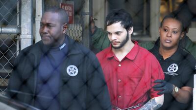 In this January 30, 2017, photo, Esteban Santiago is led from the Broward County jail for an arraignment in federal court in Fort Lauderdale. Lynne Sladky / AP