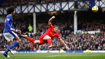 Liverpool's Steven Gerrard fires a shot at goal during the Merseyside derby. Jon Super/AP