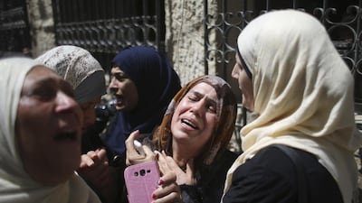 Relatives of Palestinian Mohammed Abu Latifa, 19, mourn during his funeral in Qalandiya refugee camp, near the West Bank city of Ramallah on July 27, 2015. Mohamad Torokman/Reuters