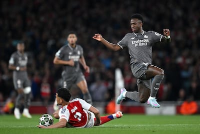 Arsenal defender William Saliba challenges Vinicius Jnr of Real Madrid during their Uefa Champions League quarter-final first leg at Emirates Stadium in 2025. Getty Images