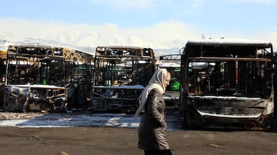Shells of buses burnt during anti-government protests, in Tehran. EPA