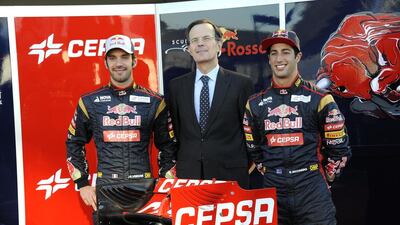 Pedro Miro, the Cepsa executive, centre, with Jean-Eric Vergne of France, left, and Daniel Ricciardo, during Scuderia Rosso’s launch of its STR8 Formula One car. Courtesy Cepsa