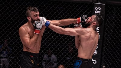 Mohammad Yahya, left, and Souhil Tairi trade blows.