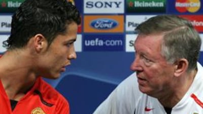 Alex Ferguson, right, says that Manchester United could not have kept Cristiano Ronaldo any longer after selling him to Real Madrid in 2009. AFP