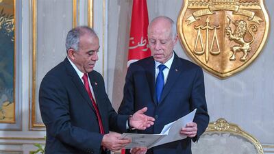 Tunisia's Prime Minister-designate Habib Jemli submits a proposed cabinet to President Kais Saied, at the presidential palace in the capital's eastern suburb of Carthage. AFP